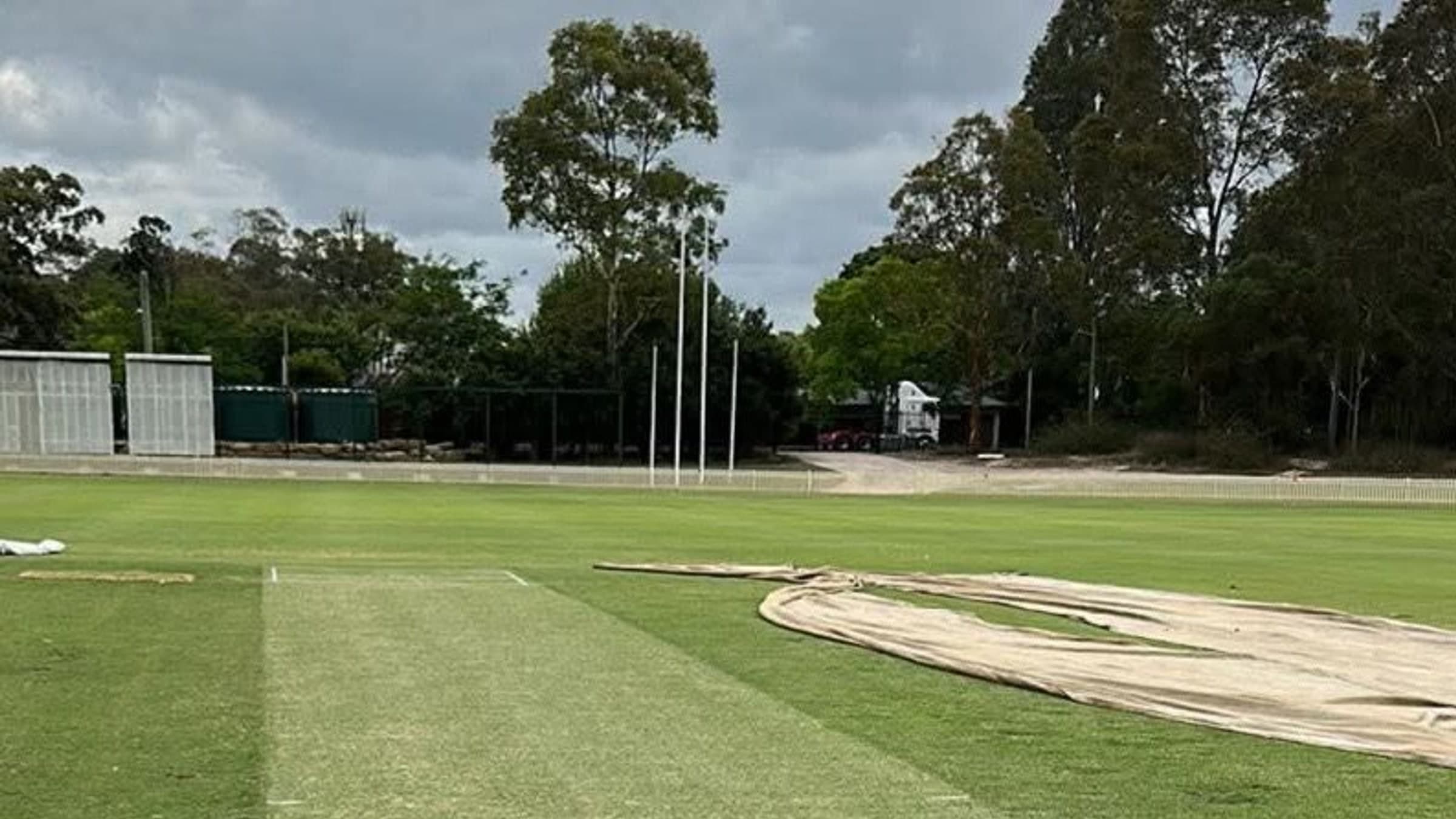 Cricket ground with prepared pitch and maintained outfield turf