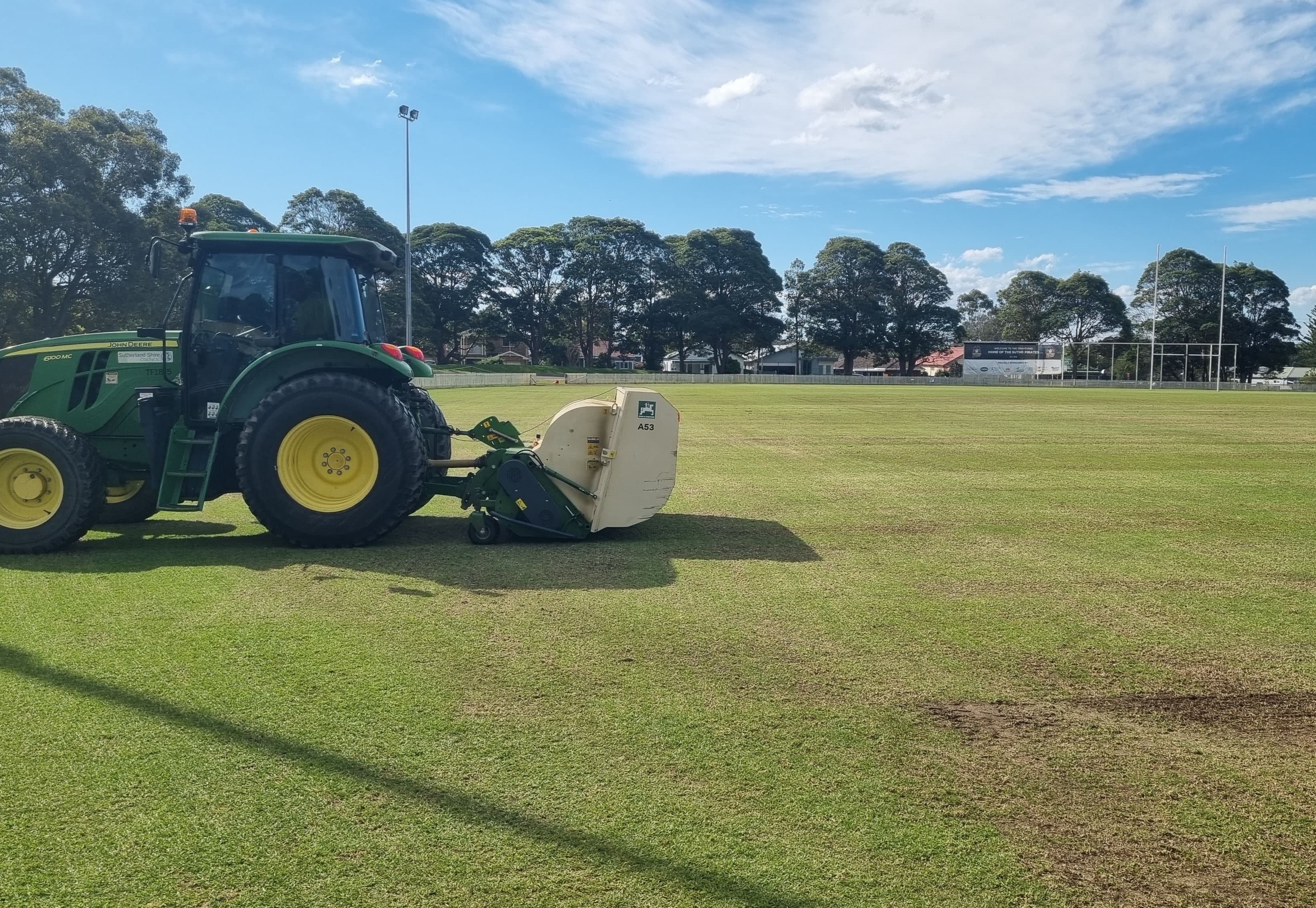 Professional turf equipment maintaining a large sports field